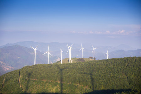 wind generators in the mountains at sunsetの写真素材