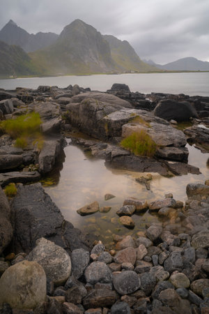 mountain landscape in the fiords of Lofoten islands on a foggy day, Norwayの写真素材