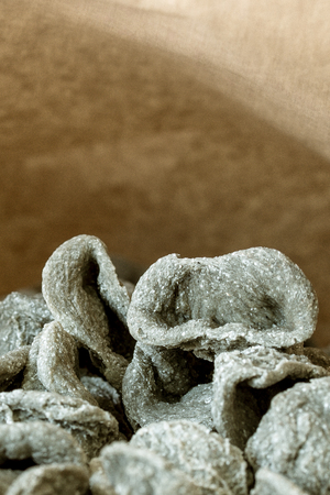 Orecchiette, pasta typical of Puglia, region of southern Italy, homemade and prepared with burnt wheat flour.の写真素材