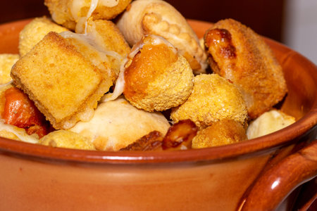 Mixed fried aperitif with fried mozzarella, Ascolan olives, small panzerotti and potato croquettes...