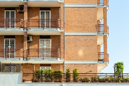 Apartments with balconies and windows in the city of Bari.の写真素材