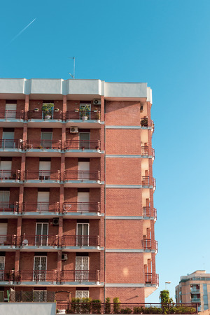 Apartments with balconies and windows in the city of Bari.の写真素材