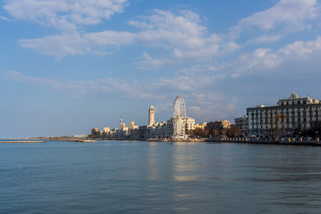 Panorama of the city of Bari, the capital of Puglia in southern Italy, with a view of the sea, buildings and the Ferris wheel.