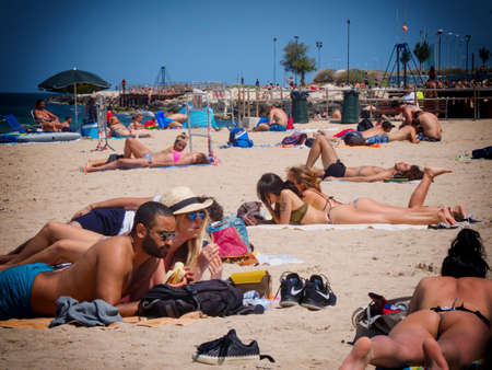 Bari, Italy - 06 07 2020: A Sunday morning on a beach in Bari, in southern Italy. People return to the sea after the end of the quarantine.のeditorial素材