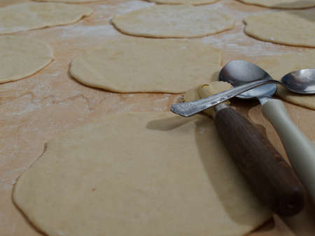 The main dough made with flour and yeast on a wooden board.の写真素材