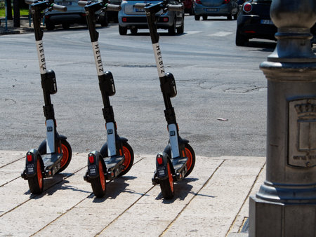 Bari, Italy - 08 02 2020: A walk on a hot August day through the streets of Bari, a city in southern Italy. Electric scooters made available by the municipality for citizens and tourists.のeditorial素材
