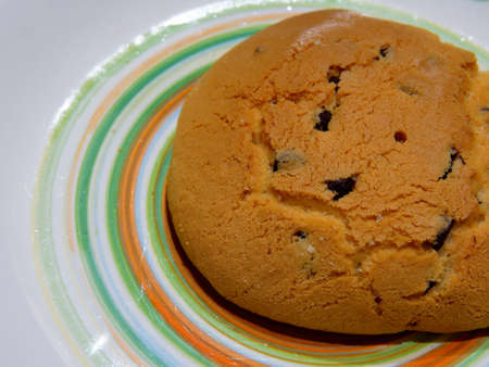 Breakfast with homemade typical Italian products. A baked biscuits with sugar on the top and chocolate chips.の写真素材