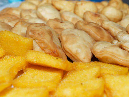 A dinner at home with friends for a birthday party. A tray filled with deep frying specialties from...