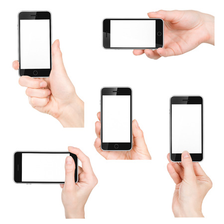 Hand holding mobile smart phone の写真素材