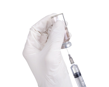 Syringe out medication technique from the ampule. Close up isolated on white background.の写真素材