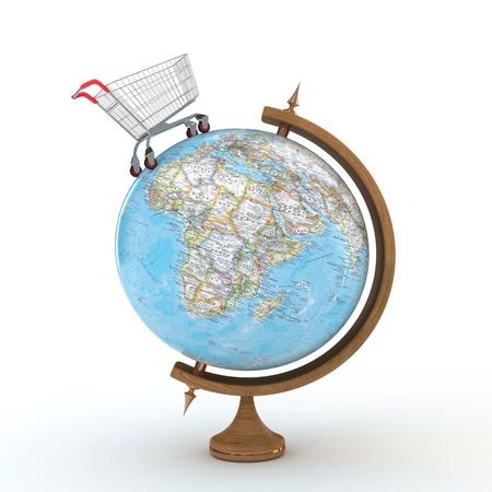 Globe with shopping cart and shopping bags, isolated on white backgroundの写真素材