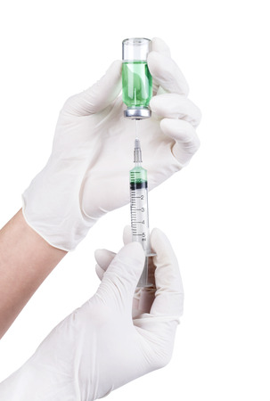 hands and ampoule isolated on whiteの写真素材