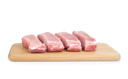 Many fresh pork chops or cutlets with parsleyの写真素材