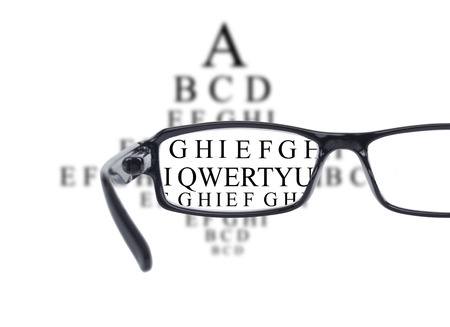Sight test seen through eye glasses, white background isolatedの写真素材