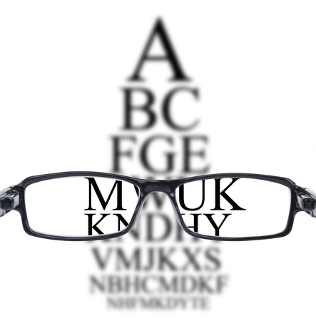 Sight test seen through eye glasses, white background isolatedの写真素材