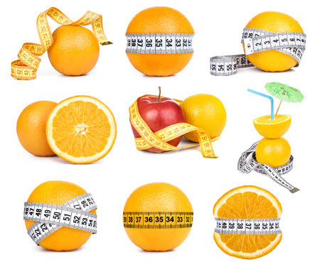 orange fruit and tape measure の写真素材