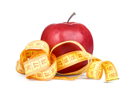 Red apple with yellow measurement isolated on whiteの写真素材