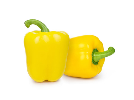 Yellow bell peppers isolated on whiteの写真素材