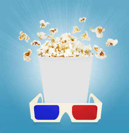 popcorn with glasses  blue backgroundの写真素材