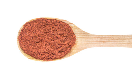 Red pepper in spoon on white backgroundの写真素材