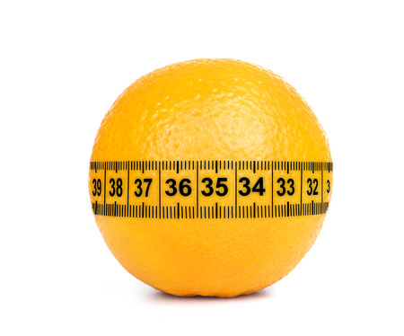 Orange Fruit with measurement isolated on whiteの写真素材