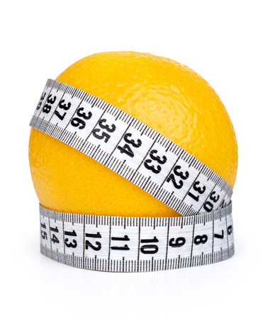 Orange fruit with tape measureの写真素材