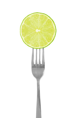 lime green on fork isolatedの写真素材