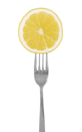 slice of lemon on the forkの写真素材