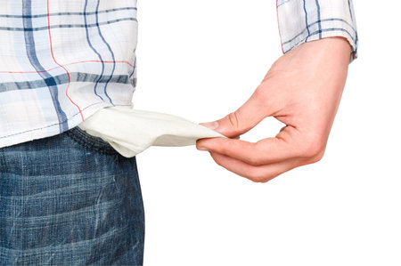 Young man pulling out empty pocket on isolated background