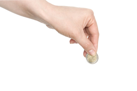 coins in finger and row stacks them isolated on whiteの写真素材