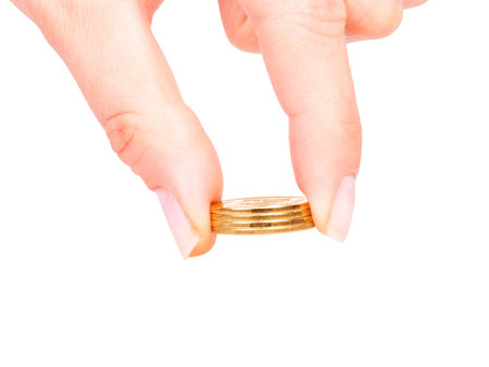 coins in finger and row stacks them isolated on whiteの写真素材