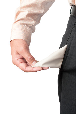 Young man pulling out empty pocket on isolated backgroundの写真素材