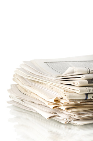newspapers on white backgroundの写真素材