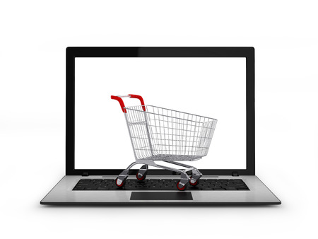 Laptop with small shopping cartの写真素材