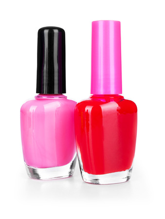 pink and red nail polish on a white background isolatedの写真素材