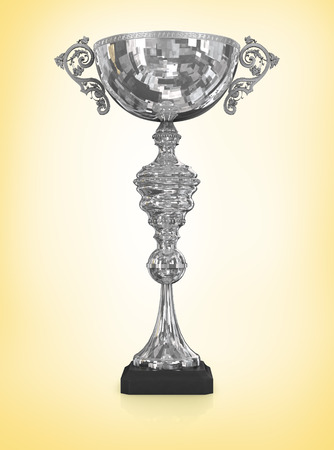 champion silver trophy isolated on yellowの写真素材