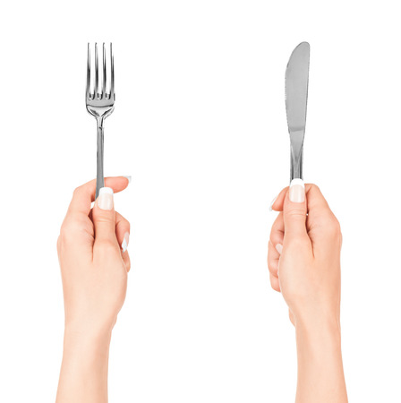 hand holding fork isolated on white backgroundの写真素材
