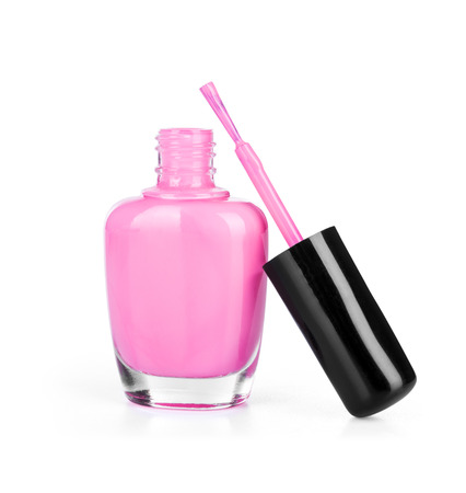 pink nail polish with brush on an isolated white backgroundの写真素材