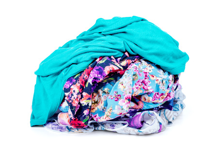A pile of dirty laundry. clothes never end. Isolated on whiteの写真素材