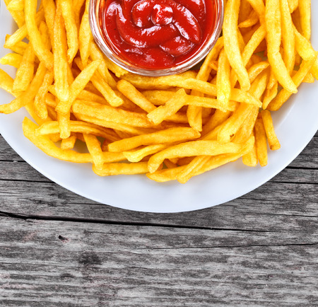 French fries closeup over woodの写真素材