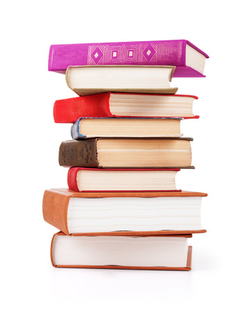 stack of old books on an isolated white backgroundの写真素材