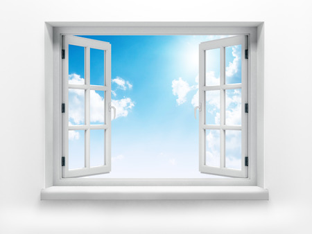 Open window against a white wall and the cloudy sky and sunの写真素材