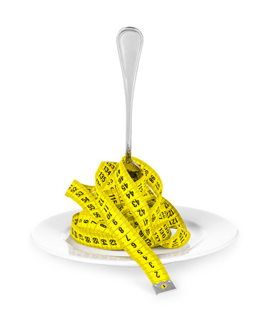 plate with a fork and measuring tape. concept of dietの写真素材