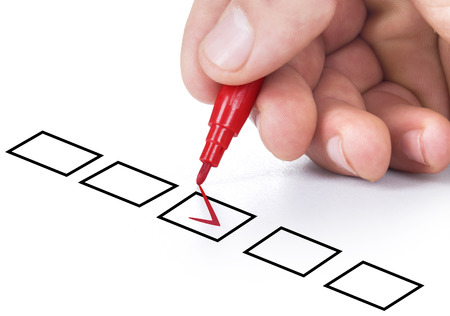 Hand with pen on white backgroundの写真素材