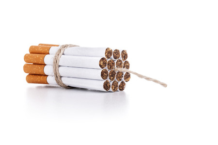 Cigarettes tied with rope and wick isolated on whiteの写真素材