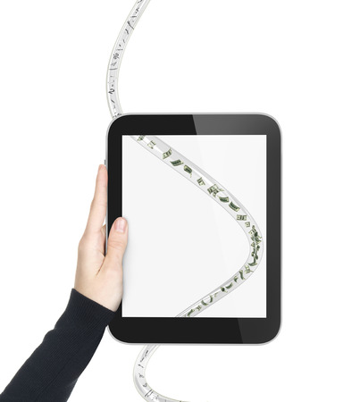 hand with tablet and wire with dollars and digitsの写真素材