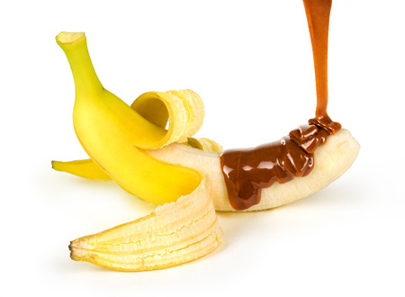 caramel is poured on a bananaの写真素材