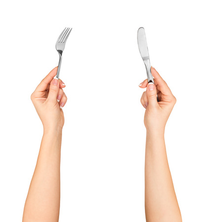 Knife and fork in hands isolated on white backgroundの写真素材