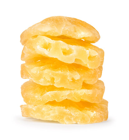 stack of slices of dried pineapple on a white backgroundの写真素材