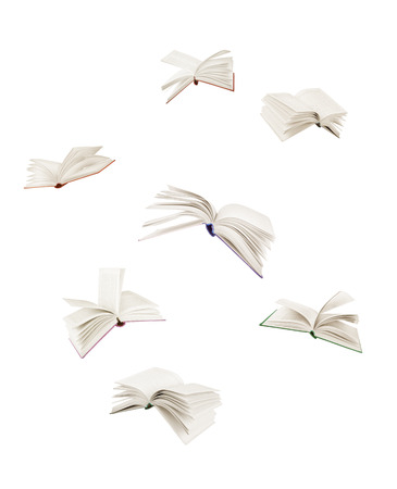 stack of books and flying books isolated on whiteの写真素材